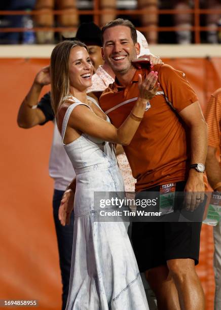 Golfer Sergio Garcia and his wife Angela Akins attend the game between the Texas Longhorns and the Wyoming Cowboys at Darrell K Royal-Texas Memorial...