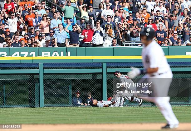 Josh Willingham and Wilkin Ramirez of the Minnesota Twins collide while chasing a fly ball hit by Omar Infante of the Detroit Tigers in the sixth...