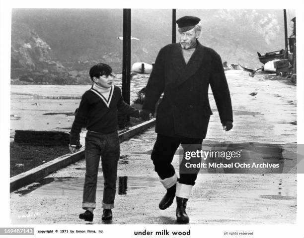 Boy walks with Peter O'Toole in a scene from the film 'Under Milk Wood', 1972.