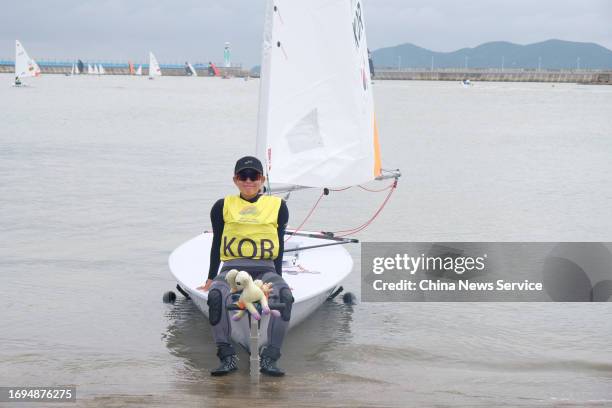 An athlete from South Korea gets ready for a sailing race ahead of the 19th Asian Games at NBX Sailing Centre on September 21, 2023 in Ningbo,...
