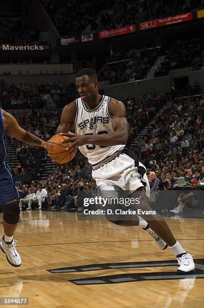 David Robinson of the San Antonio Spurs drives to the basket during the game against the Dallas Mavericks at SBC Center on December 11, 2002 in San...