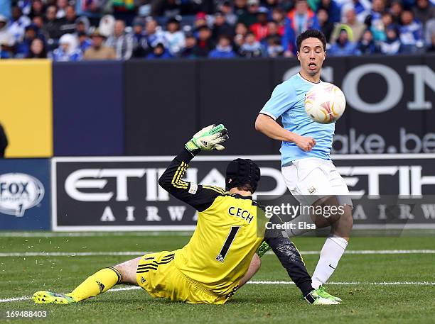 Samir Nasri of Manchester City scores a goal past Petr Cech#1 of Chelsea at Yankee Stadium on May 25, 2013 in the Bronx borough of New York City....