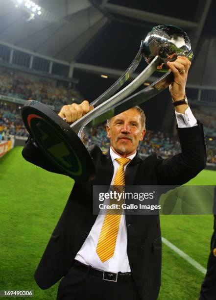 Head coach Stuart Baxter of the Chiefs celebrates with the trophy after the Nedbank Cup Final between SuperSport United and Kaizer Chiefs at Moses...