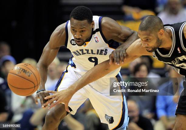 Tony Allen of the Memphis Grizzlies and Tim Duncan of the San Antonio Spurs go after a loose ball in the first quarter during Game Three of the...