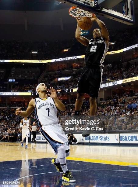 Kawhi Leonard of the San Antonio Spurs dunks the ball against Jerryd Bayless of the Memphis Grizzlies in the second quarter during Game Three of the...