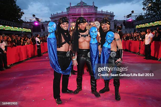 Guests, dressed with fancy costumes attend the 'Life Ball 2013 - Magenta Carpet Arrivals' at City Hall on May 25, 2013 in Vienna, Austria.