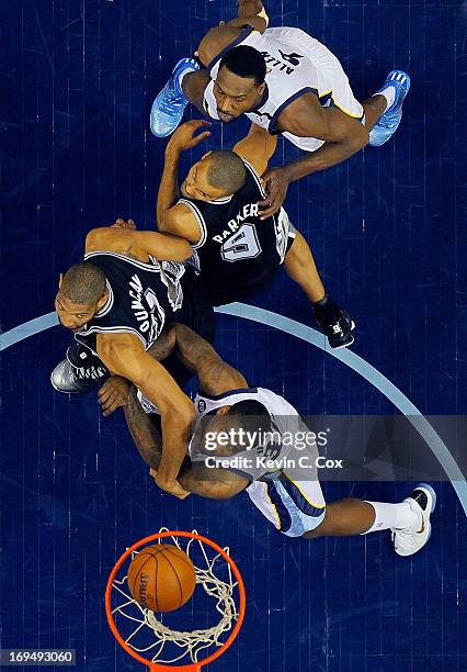 Ed Davis and Tony Allen of the Memphis Grizzlies go after a rebound against Tim Duncan and Tony Parker of the San Antonio Spurs in the first half...