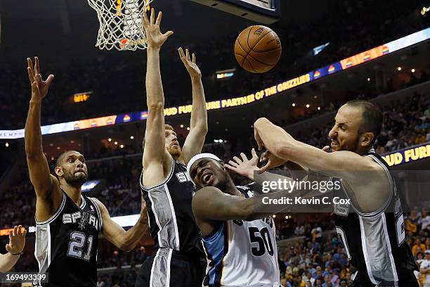 Manu Ginobili of the San Antonio Spurs and Zach Randolph of the Memphis Grizzlies battle for the ball in the second half during Game Three of the...