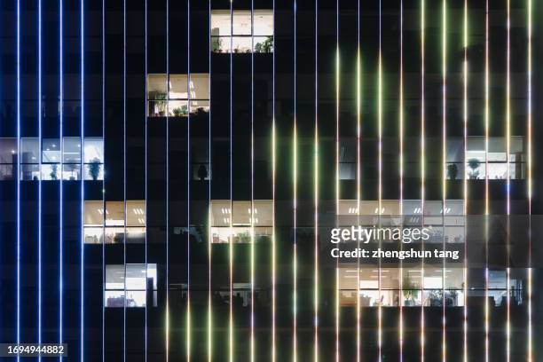 illuminated office building at night - connection pattern stock pictures, royalty-free photos & images