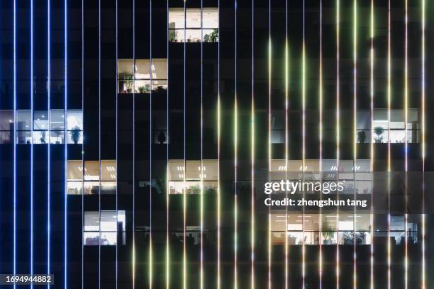 illuminated office building at night - manipulação de cor - fotografias e filmes do acervo
