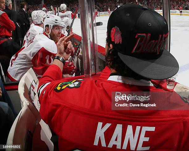 Chicago Blackhawks fan pounds on the glass to get the attention of Daniel Cleary of the Detroit Red Wings during Game Five of the Western Conference...