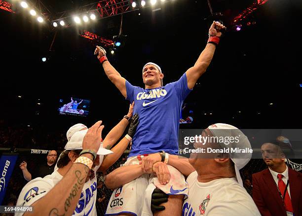 Junior dos Santos reacts to his victory over Mark Hunt in their heavyweight bout during UFC 160 at the MGM Grand Garden Arena on May 25, 2013 in Las...