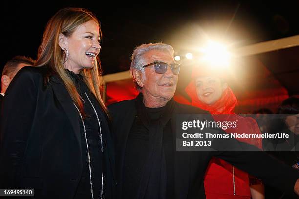 Roberto Cavalli and Eva Cavalli attend the 'Life Ball 2013 - Magenta Carpet Arrivals' at City Hall on May 25, 2013 in Vienna, Austria.