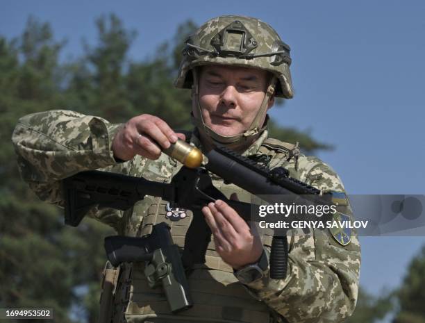 Commander of the Joint Forces the Armed Forces of Ukraine, lieutenant general Serhiy Nayev arms a grenade launcher during military training exercise...