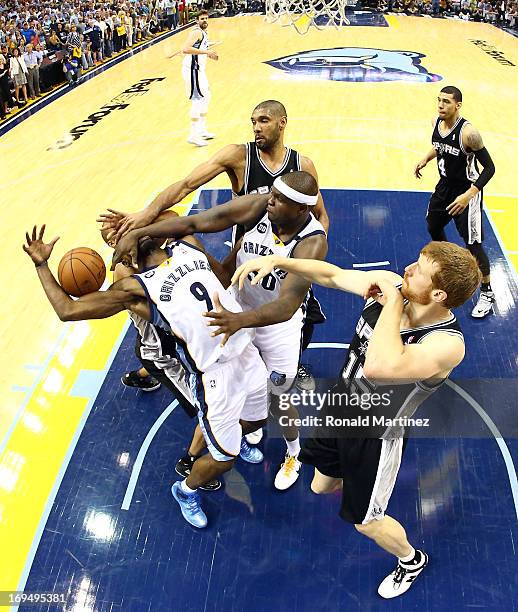 Tony Allen of the Memphis Grizzlies is hit in the face by teammate Zach Randolph against Tony Parker of the San Antonio Spurs during Game Three of...