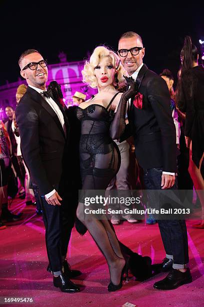 Amanda Lepore, Dean Caten and Dan Caten attend the 'Life Ball 2013 - Magenta Carpet Arrivals' at City Hall on May 25, 2013 in Vienna, Austria.