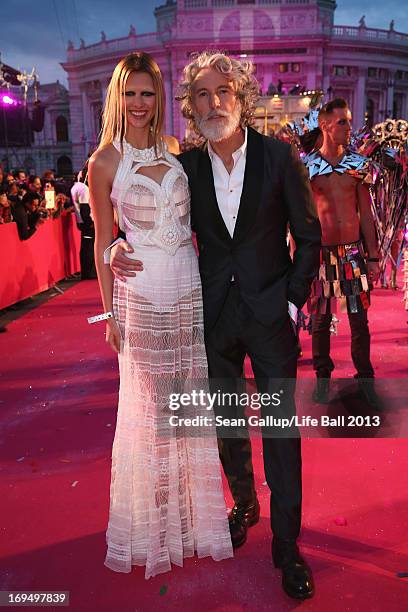 Aiden Shaw and model attend the 'Life Ball 2013 - Magenta Carpet Arrivals' at City Hall on May 25, 2013 in Vienna, Austria.