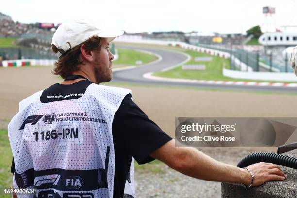 Sebastian Vettel watches the action during practice ahead of the F1 Grand Prix of Japan at Suzuka International Racing Course on September 22, 2023...