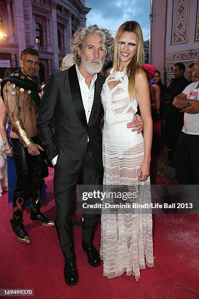 Aiden Shaw and model attend the 'Life Ball 2013 - Magenta Carpet Arrivals' at City Hall on May 25, 2013 in Vienna, Austria.