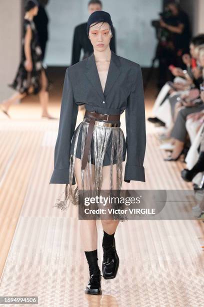 Model walks the runway during the Prada Ready to Wear Spring/Summer 2024 fashion show as part of the Milan Fashion Week on September 21, 2023 in...