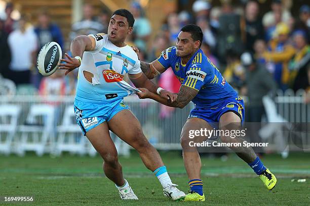 Mark Ioane of the Titans offloads the ball during the round 11 NRL match between the Parramatta Eels and the Gold Coast Titans at Glen Willow...