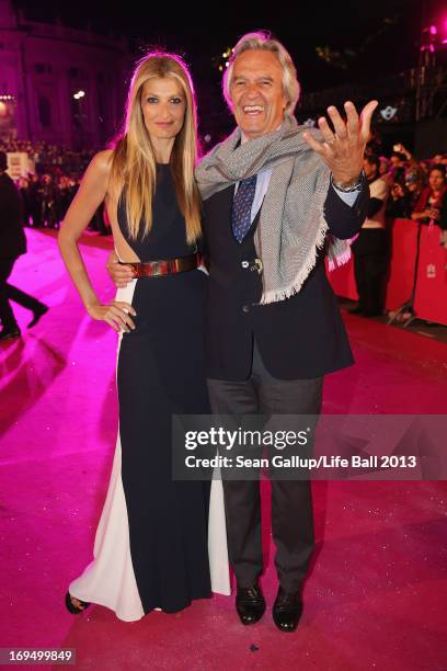 Model Tereza Maxova and jazz guitarist John McLaughlin arrive on the Magenta Carpet at the 2013 Life Ball at City Hall on May 25, 2013 in Vienna,...