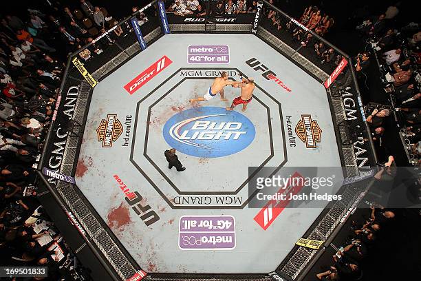 An overhead view of the Octagon as Junior "Cigano" dos Santos punches Mark Hunt in their heavyweight bout during UFC 160 at the MGM Grand Garden...