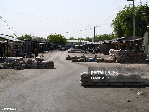 Barriers made of sandbags are seen in the street leading to local churches in Maiduguri, Nigeria on May 26, 2013. Cars are no longer allowed to...