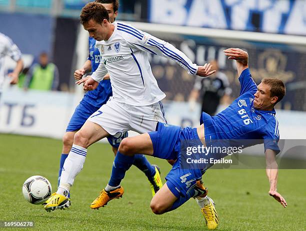 Nikita Chicherin of FC Dynamo Moscow is challenged by Aleksandr Salugin of FC Volga Nizhny Novgorod during the Russian Premier League match between...