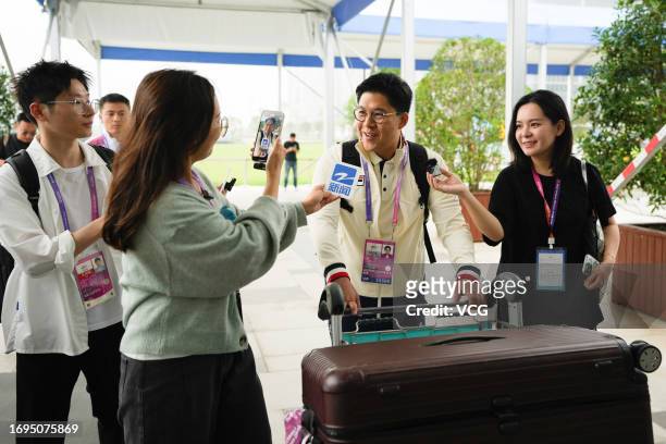 Head of the Hong Kong delegation Kenneth Fok Kai-kong meets media as he arrives at the athletes' village ahead of the 19th Asian Games on September...