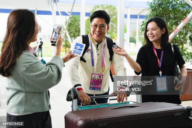 Head of the Hong Kong delegation Kenneth Fok Kai-kong meets media as he arrives at the athletes' village ahead of the 19th Asian Games on September...