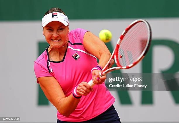 Nadia Petrova of Russia plays a backhand during her women's singles match against Monica Puig of Puerto Rico during day one of the French Open at...