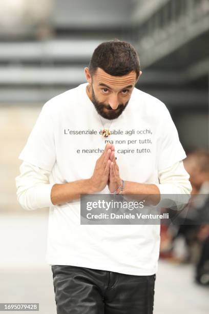 Walter Chiapponiaknowledge the applause of the public after the runway at the Tod's fashion show during the Milan Fashion Week Womenswear...