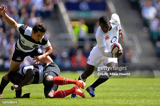 Christian Wade of England makes a break enroute to scoring his team's fourth try during the rugby union international match between England and The...