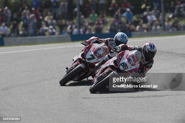 Ayrton Badovini of Italy and Team Ducati Alstare leads Carlos Checa of Spain and Team Ducati Alstare in Race 1 of the World Superbikes during round...