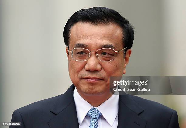 Chinese Prime Minister Li Keqiang arrives at the Chancellery to meet with German Chancellor Angela Merkel on May 26, 2013 in Berlin, Germany. On his...