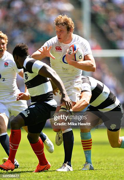 Joe Launchbury of England charges upfield during the rugby union international match between England and The Barbarians at Twickenham Stadium on May...