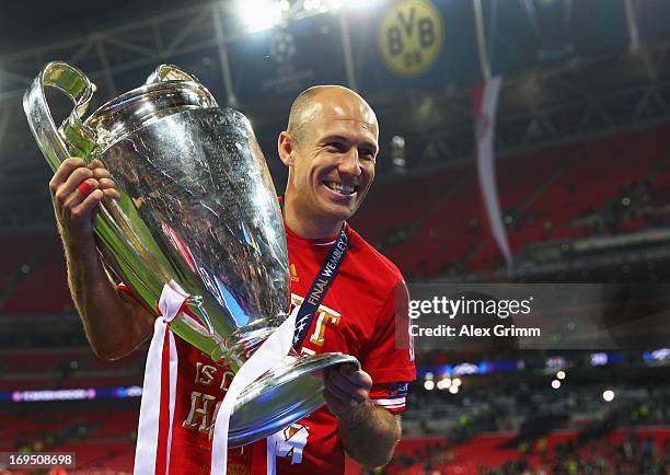 Arjen Robben of Bayern Muenchen celebrates with the trophy after victory in the UEFA Champions League final match between Borussia Dortmund and FC...