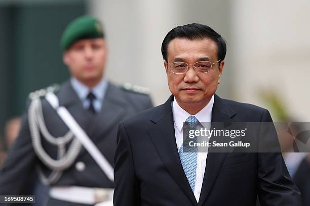 Chinese Prime Minister Li Keqiang arrives at the Chancellery to meet with German Chancellor Angela Merkel on May 26, 2013 in Berlin, Germany. On his...