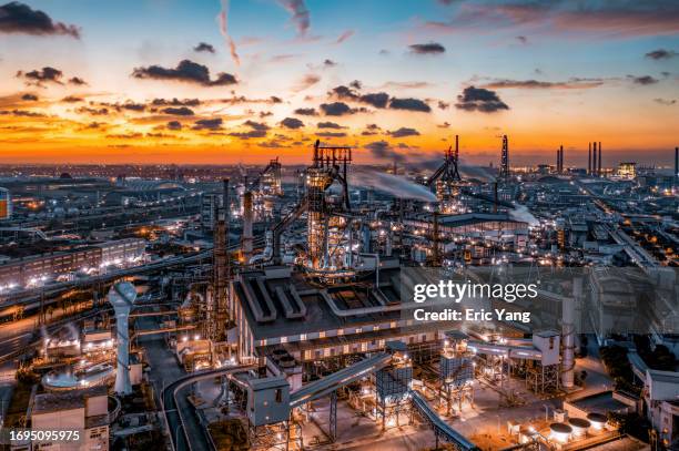 aerial steel plant in beautiful sunset scenery - steelmaking stock pictures, royalty-free photos & images