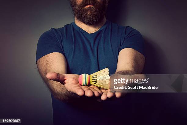 holding a shuttle cock - scott macbride stock pictures, royalty-free photos & images