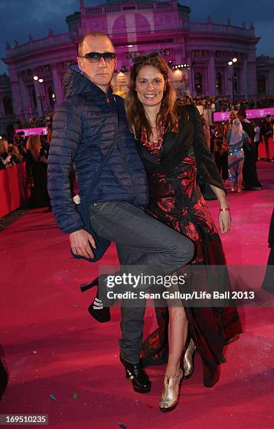 Sarah Wiener and Peter Lohmeyer arrive on the Magenta Carpet at the 2013 Life Ball at City Hall on May 25, 2013 in Vienna, Austria.