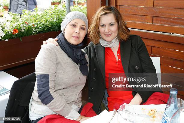 Actresses Valerie Benguigui and Armelle attend Roland Garros Tennis French Open 2013 - Day 1 on May 26, 2013 in Paris, France.