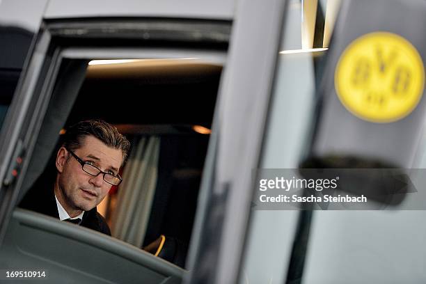 Michael Zorc looks on from the team bus as Borussia Dortmund return to Dortmund Airport after the UEFA Champions League Final on May 26, 2013 in...