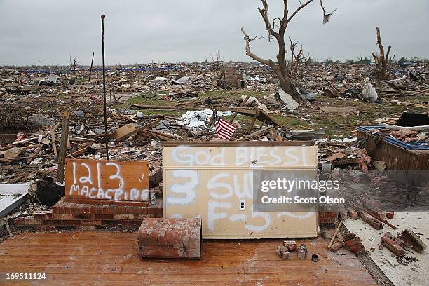 Slab is all that remains of a tornado-damaged home on May 26, 2013 in Moore, Oklahoma. Residents and volunteers continue to search for possessions...