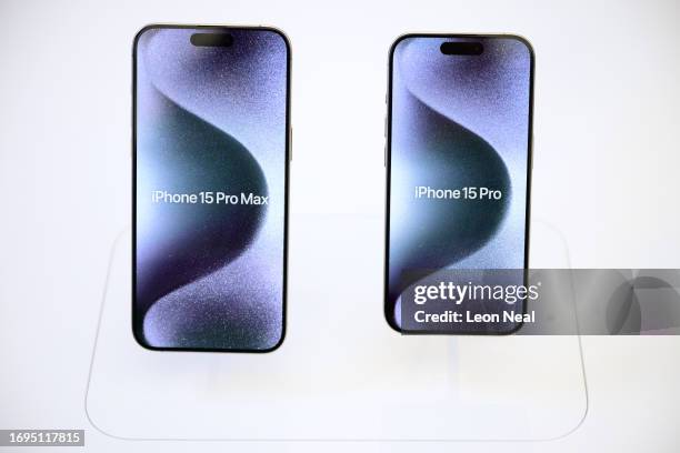 An iPhone 15 Pro Max and an iPhone 15 Pro are on display as iPhone 15 handsets go on sale at the Apple Store on September 22, 2023 in London,...