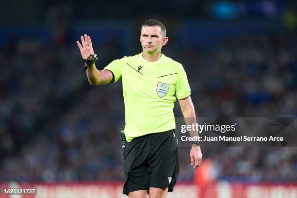 Referee Michael Oliver reacts during the UEFA Champions League match between Real Sociedad and FC Internazionale at Reale Arena on September 20, 2023...