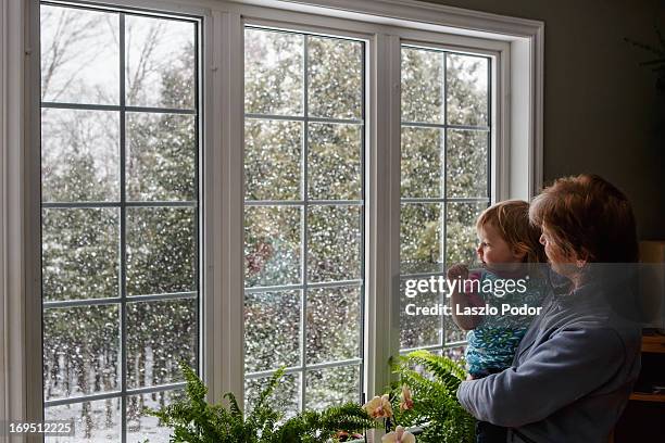 snowy afternoon - grandmother granddaughter stock pictures, royalty-free photos & images