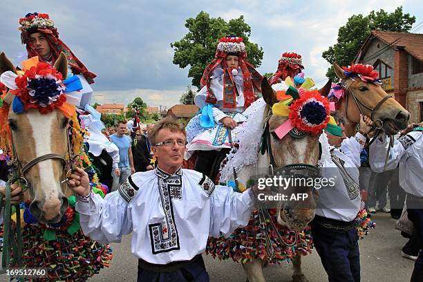 People in colorful costumes take part in the traditional Royal Ride festival in Vlcnov some 100 kilometers southeast of Brno, Czech Republic, on May...