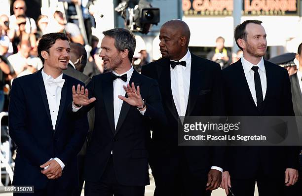 Actor Orlando Bloom, director Jerome Salle and actors Conrad Kemp Forest Whitaker attends the 'Zulu' Premiere and Closing Ceremony during the 66th...